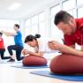 People doing strength and sensorimotor training on mats.