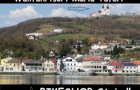 Blick auf Maria Taferl mit Kirche auf einem H&uuml;gel, darunter der Ort und ein Hinweis auf den Bikeshop Steindl.