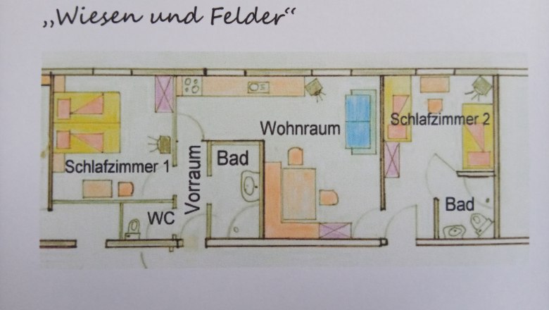 Grundriss einer Ferienwohnung mit zwei Schlafzimmern, Wohnzimmer, Bad und WC.