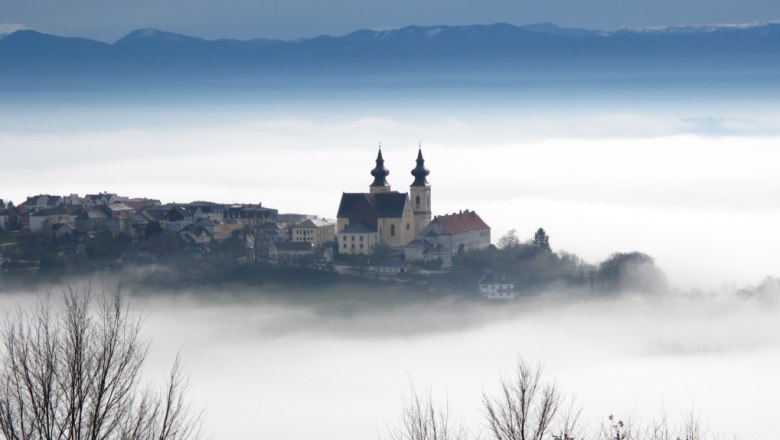 Maria Taferl in the fog with church and surrounding buildings.